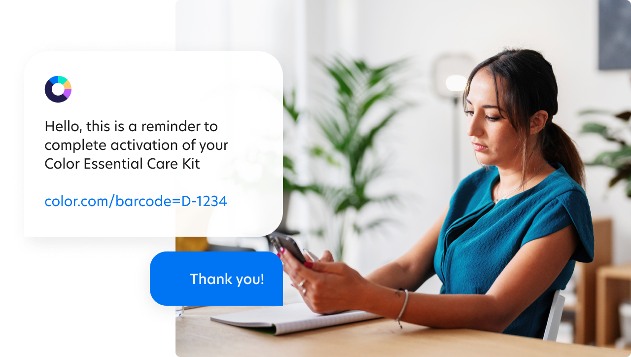 Woman sitting in a chair holding a phone with enlarged text bubbles showing Color reminding her to activiate her kit