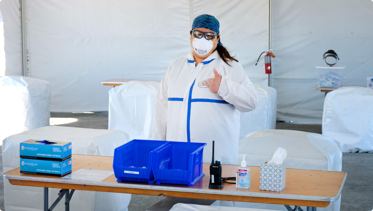 Person working at an outdoor Color COVID-19 testing site