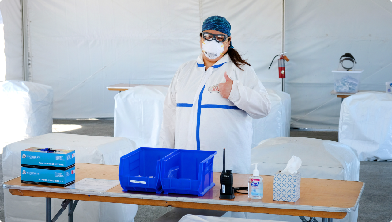 Person working at an outdoor Color COVID-19 testing site