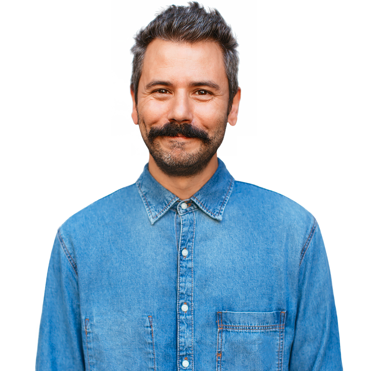 Smiling man wearing buttoned up denim shirt