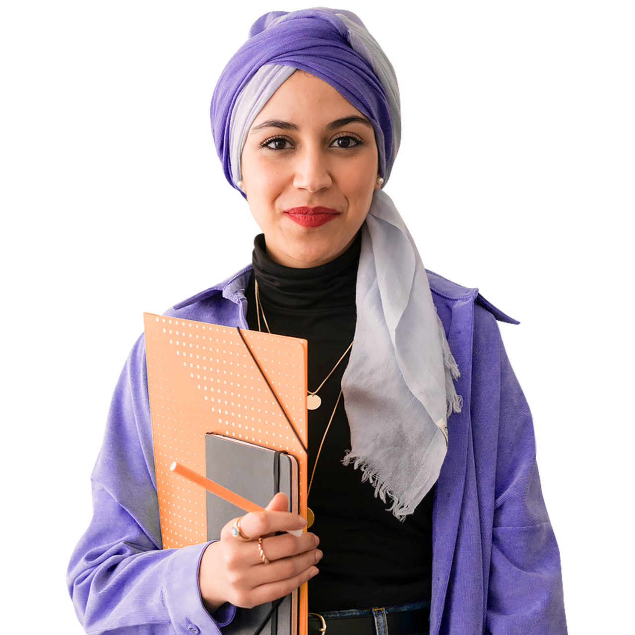 Smiling woman wearing headwrap holding a pencil and notebook